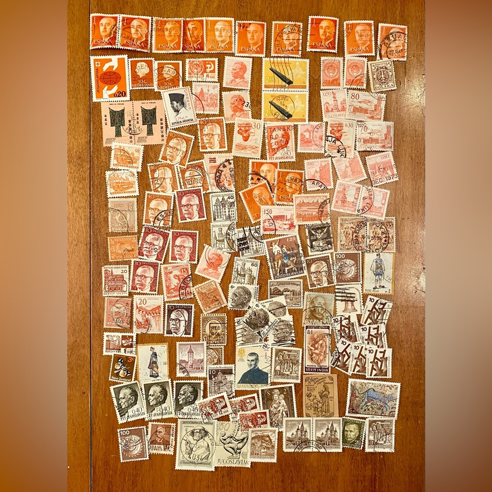 Vintage international & USA Postal Stamps - over 100 postmarked. Orange/Brown #1